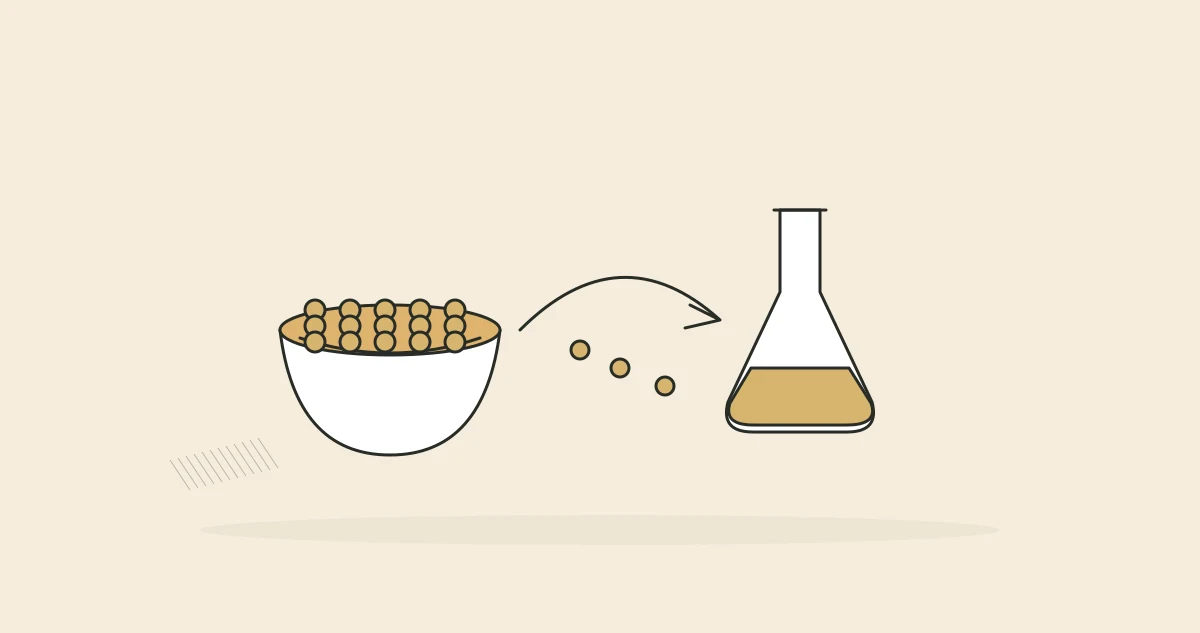 Lentils spilling from a bowl toward a laboratory flask.